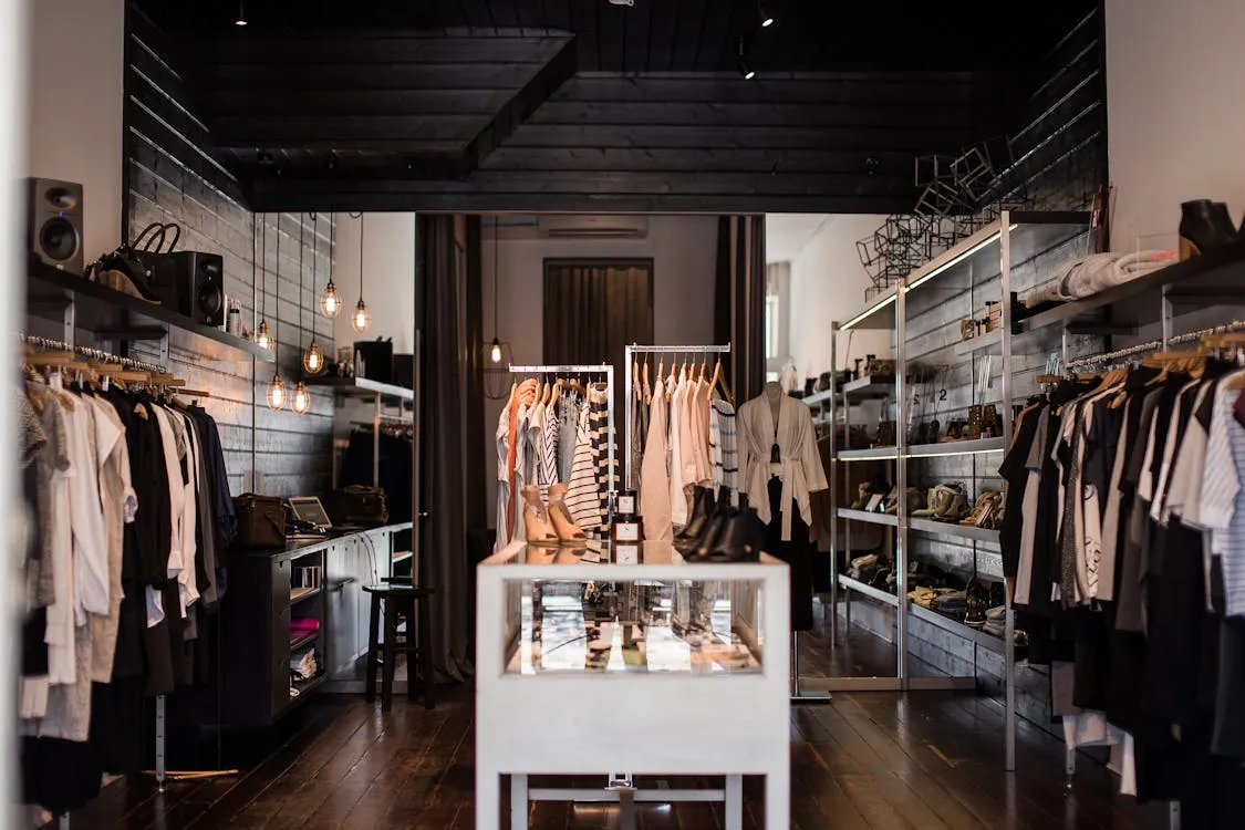 Fashion boutique with clothing displays and modern retail interior design