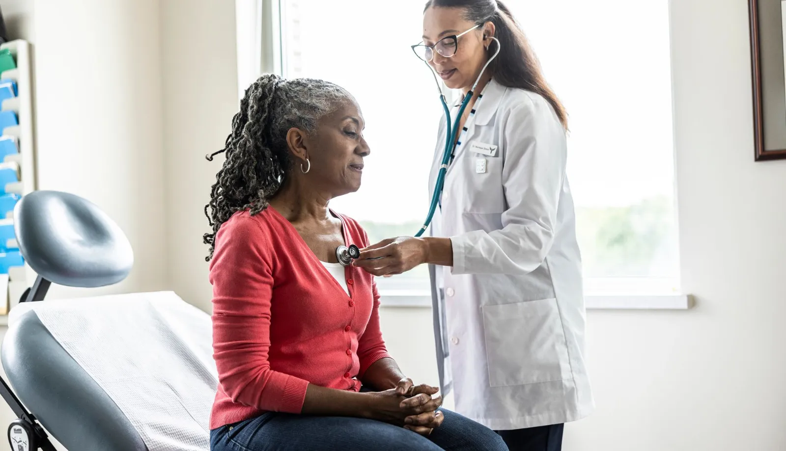 Modern medical facility with healthcare professionals using digital systems